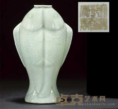 A celadon glazed twin fish vase 